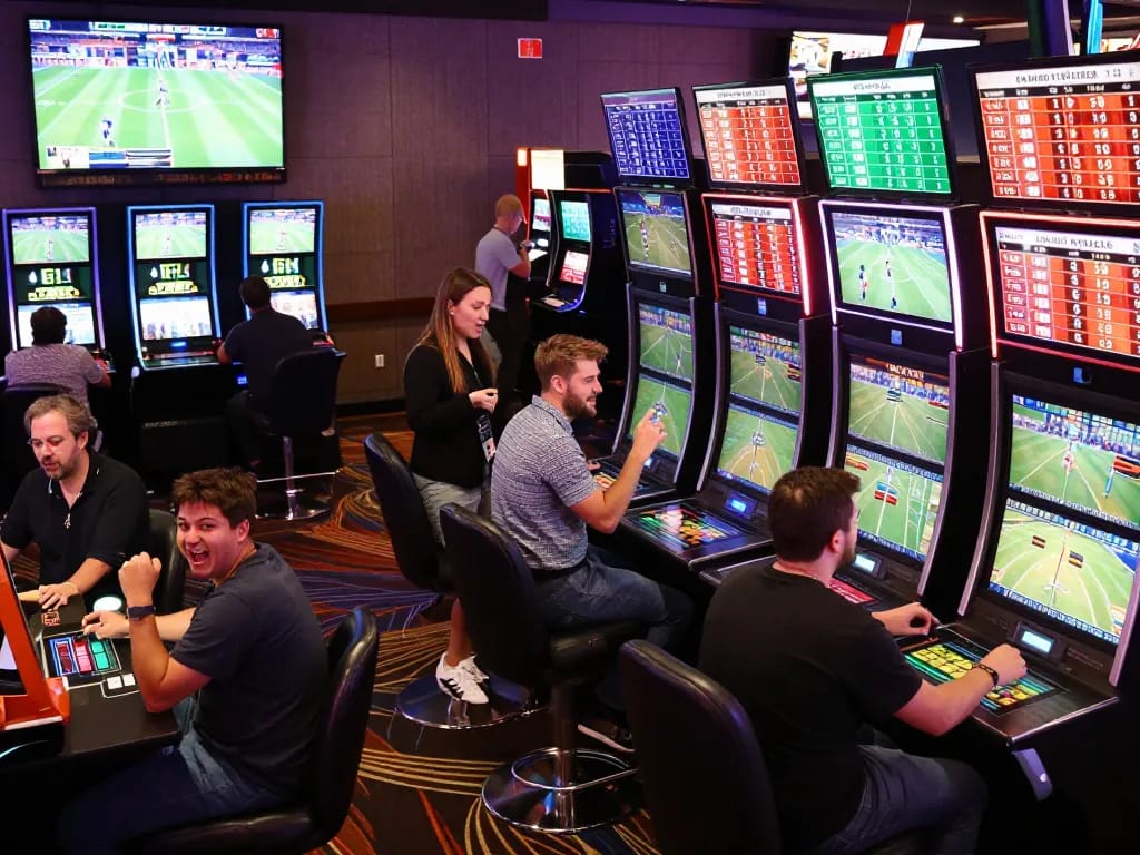 SHBET players engaging in thrilling sports betting within a vibrant casino environment showcasing live events.