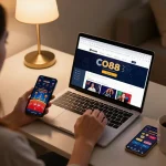 Engaged player using CO88 online casino platform on a laptop in a cozy home setting.