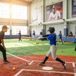 Hitclub baseball training scene with young athletes practicing and coaches guiding in an energetic indoor facility