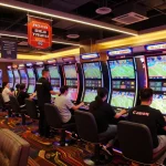 Engaged bettors placing wagers in a lively sports betting lounge, exploring soi keo nha cai options