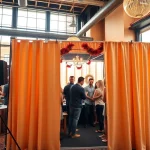 Engage with photo booth rental chicago at a lively event with vibrant props and natural lighting.
