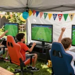 boys birthday party with kids playing video games in a vibrant tent setup